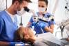 male-dentist-working-with-dental-microscope_329181-20732